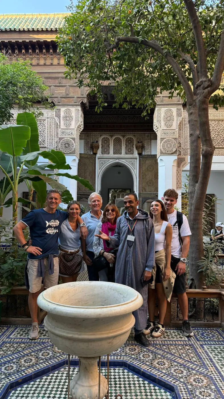 Youssef sharing a warm moment with travellers in Morocco